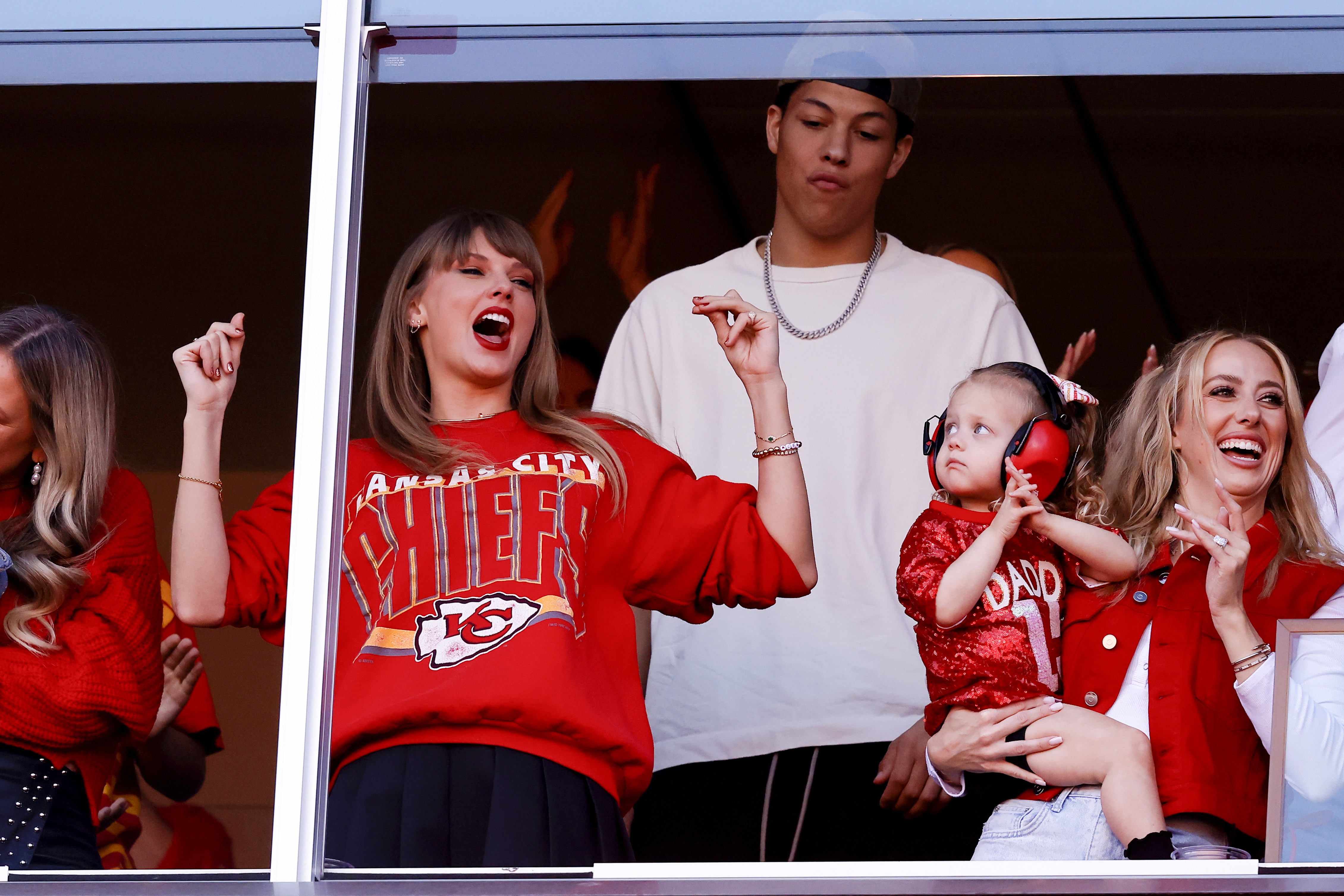 KANSAS CITY, MISSOURI - OCTOBER 22: Taylor Swift and Brittany Mahomes celebrate a touchdown during the second quarter of the game between the Kansas City Chiefs and the Los Angeles Chargers at GEHA Field at Arrowhead Stadium on October 22, 2023 in Kansas City, Missouri. (Photo by David Eulitt/Getty Images)