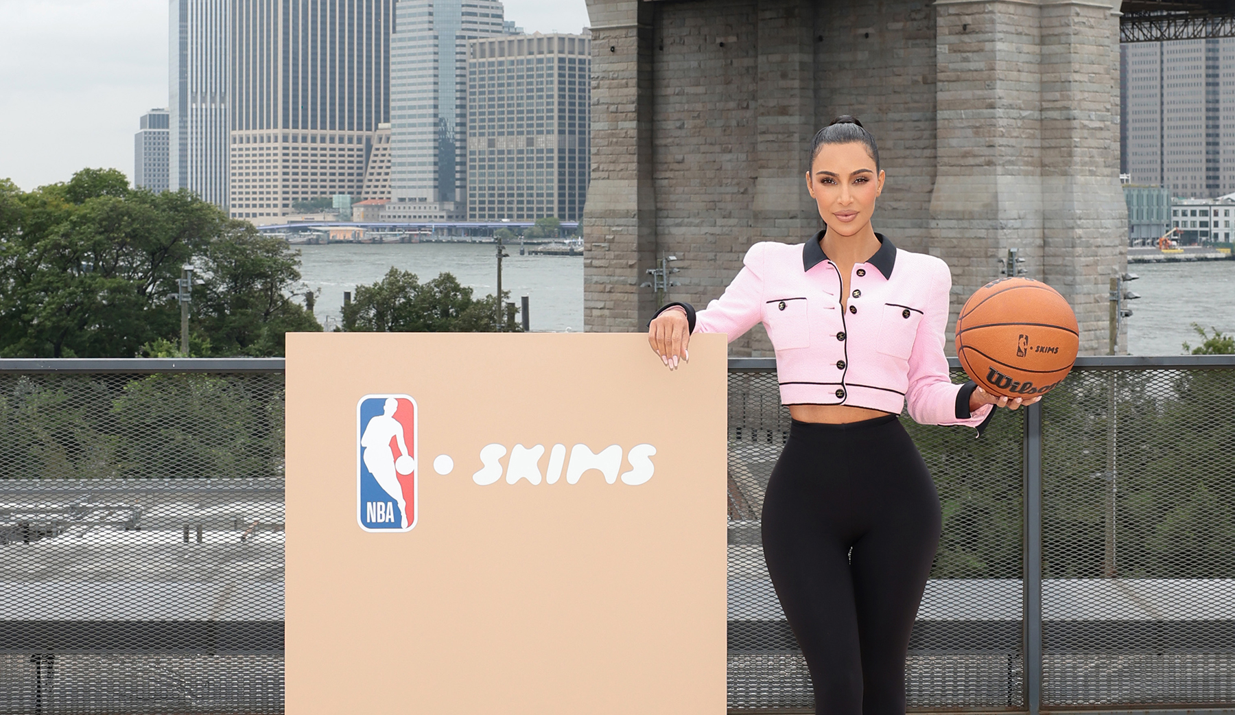 who owns skims, NEW YORK, NEW YORK - SEPTEMBER 28: Kim Kardashian poses at the announcement of SKIMS being named the official underwear partner of the NBA, WNBA, and USA Basketball on September 28, 2023 in New York City. (Photo by Dimitrios Kambouris/WireImage for SKIMS)