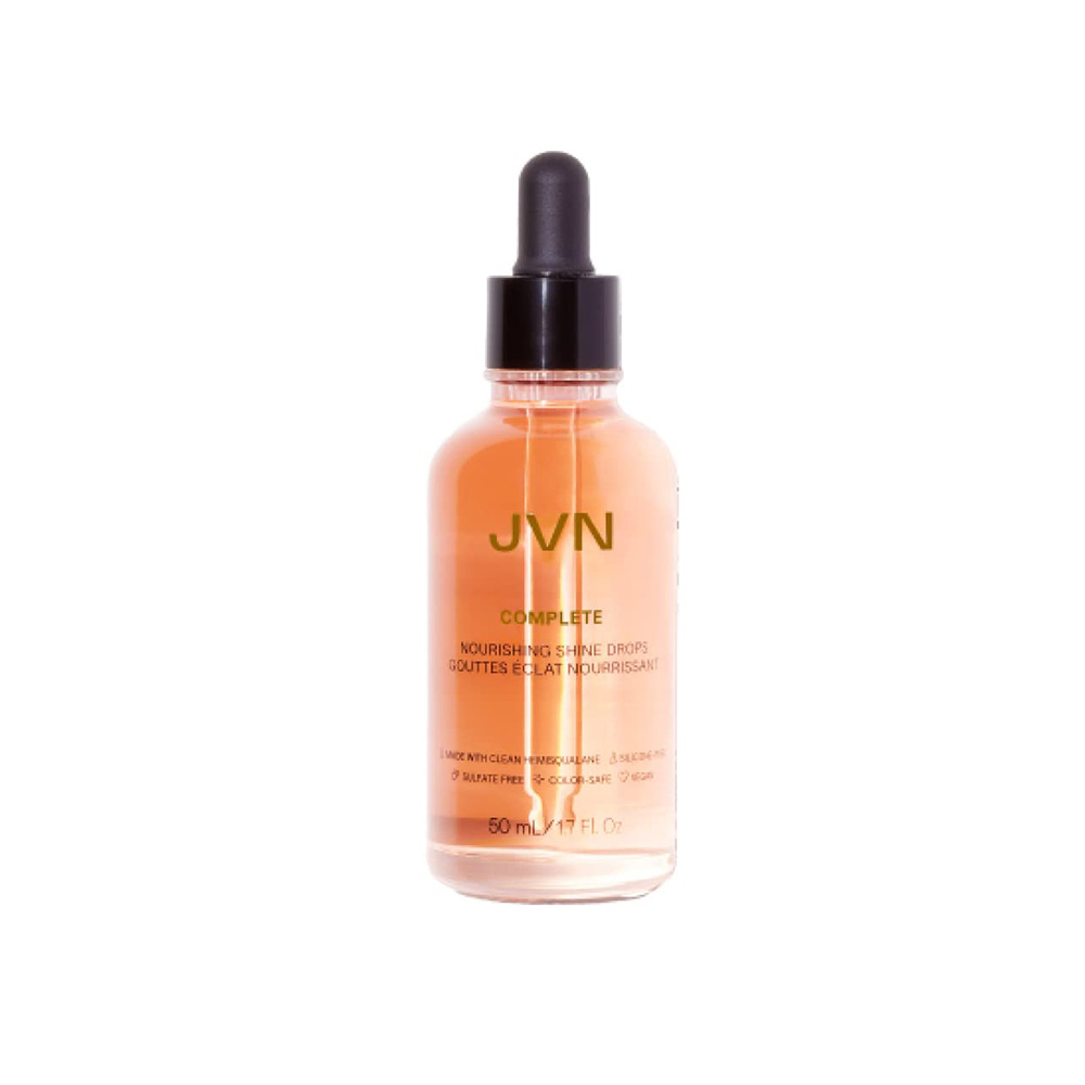 orangey bottle of oil with a black cap