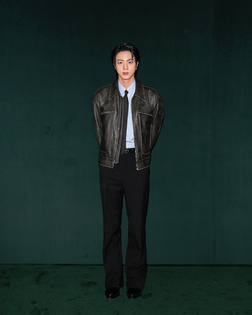 Jin attends Gucci's fall 2025 fashion show on Feb. 25 in Milan.