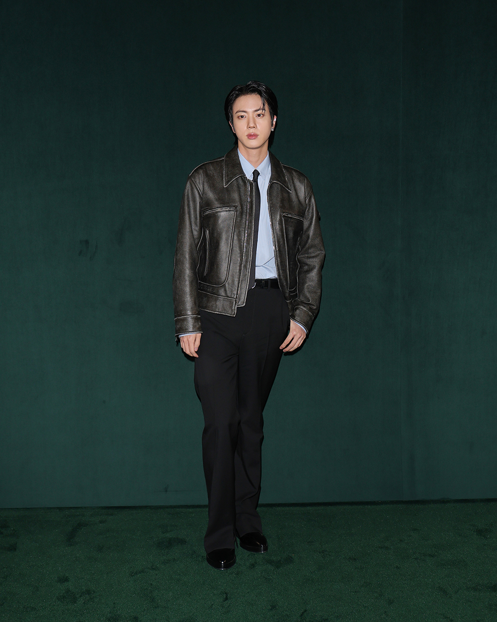 Jin attends Gucci's fall 2025 fashion show on Feb. 25 in Milan.