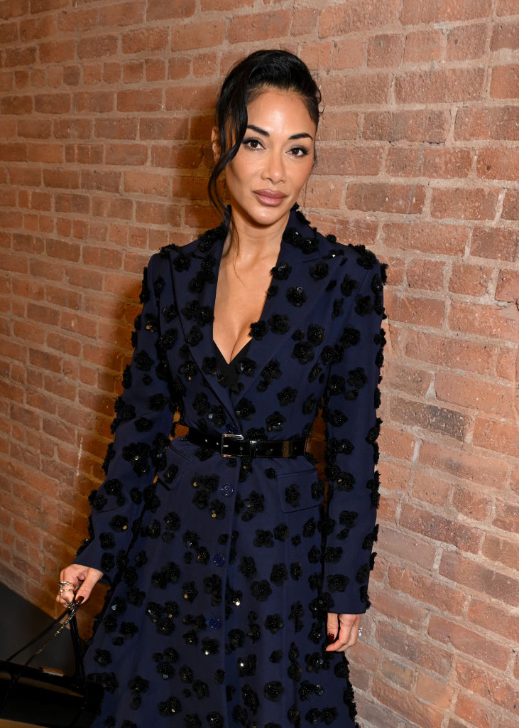 Nicole Scherzinger at the Michael Kors fall 2025 fashion show on Feb. 11 in New York, floral coatdress, front row
