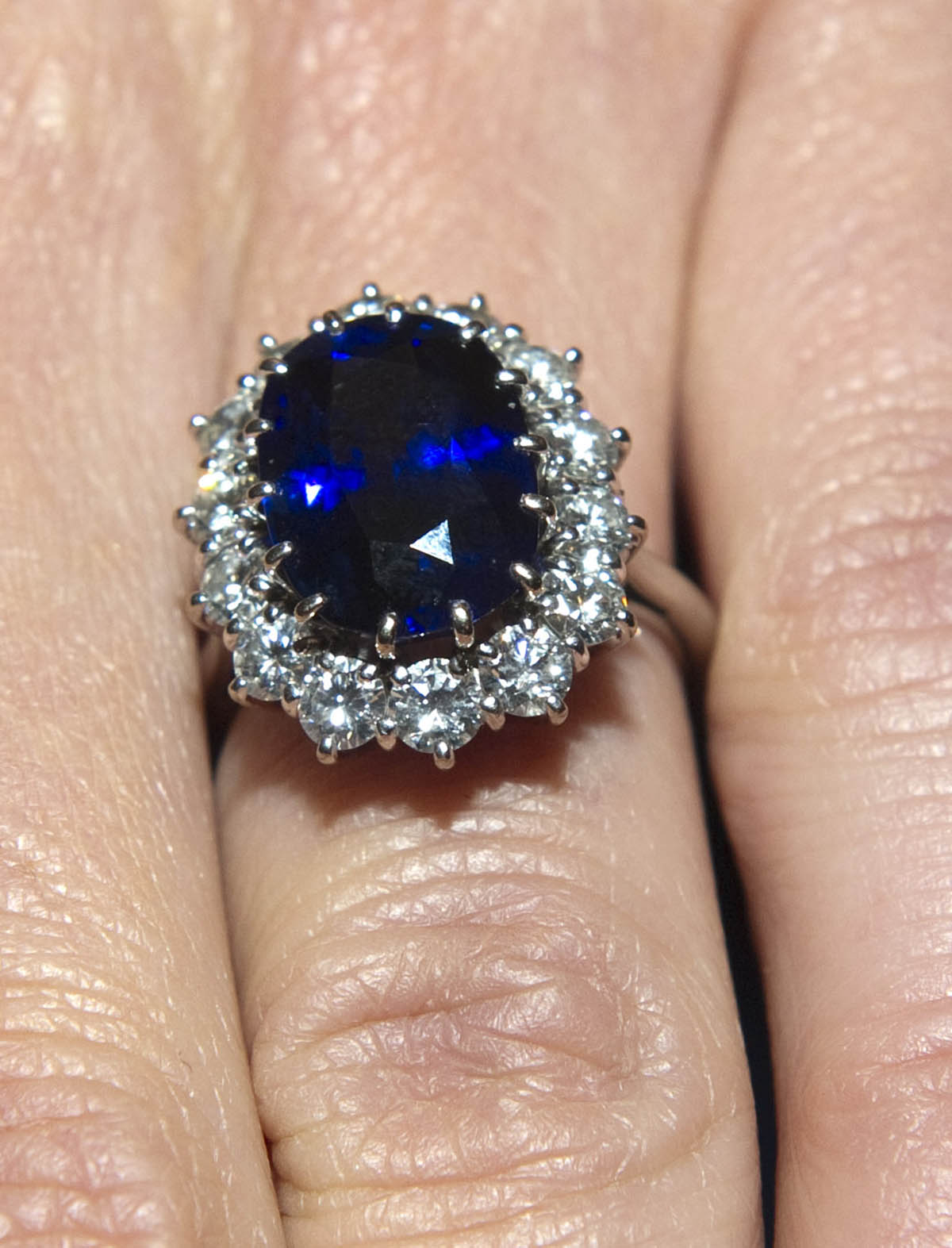 LONDON, ENGLAND - NOVEMBER 16:  A close up of Kate Middleton's engagement ring as she poses for photographs in the State Apartments with her fiance Prince William of St James Palace on November 16, 2010 in London, England. After much speculation, Clarence House today announced the engagement of Prince William to Kate Middleton. The couple will get married in either the Spring or Summer of next year and continue to live in North Wales while Prince William works as an air sea rescue pilot for the RAF. The couple became engaged during a recent holiday in Kenya having been together for eight years.  (Photo by Arthur Edwards - WPA Pool/Getty Images), princess diana Ceylon sapphire engagement ring, kate middleton engagement ring