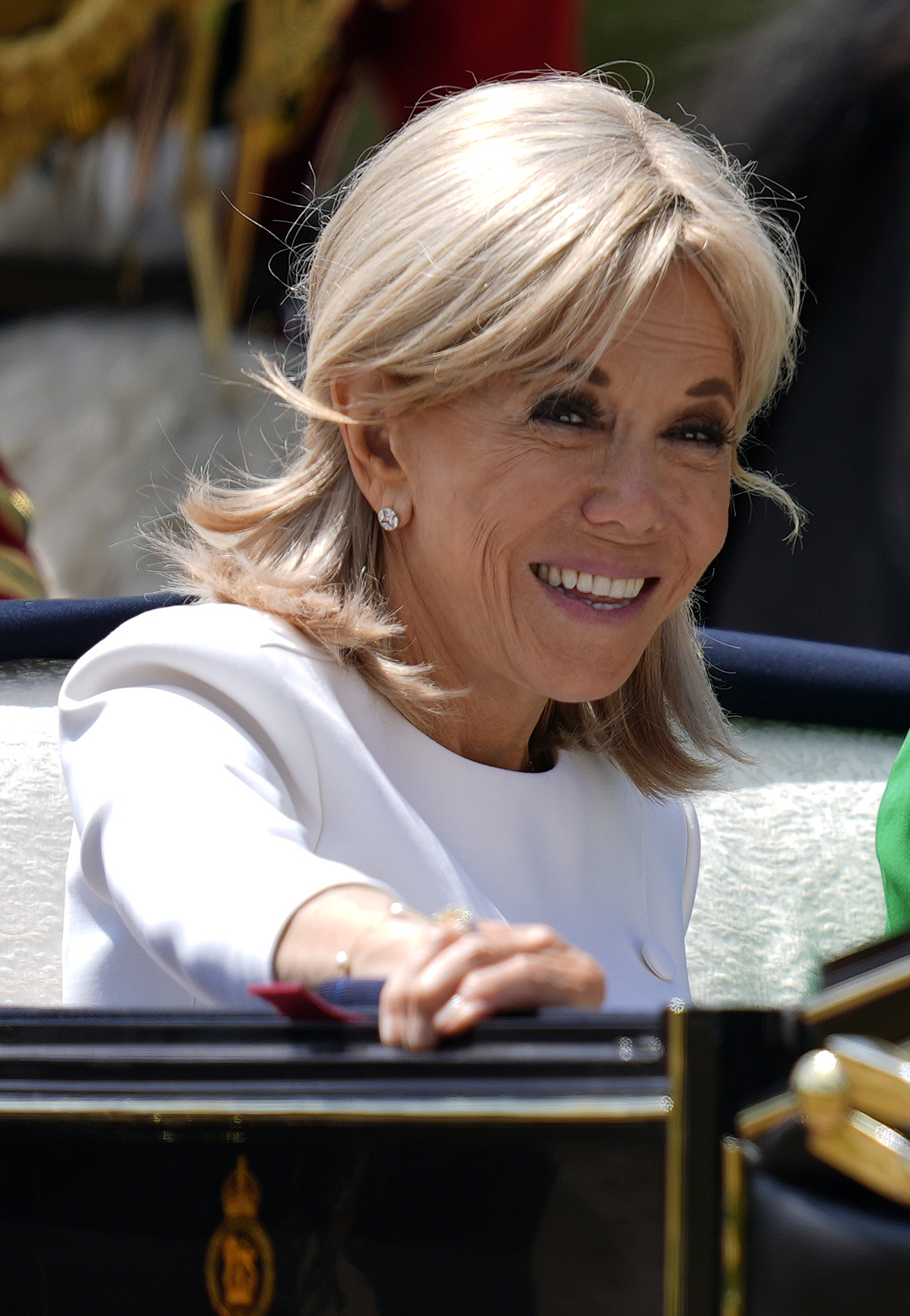 WINDSOR, ENGLAND - JULY 8:  Brigitte Macron rides in the carriage procession to Windsor Castle ahead of the Ceremonial Welcome for the state visit to the UK of the President of France Emmanuel Macron and his wife Brigitte Macron at Windsor Castle on July 8, 2025 in Windsor, England. President Emmanuel Macron and Mrs Brigitte Macron visit the UK in the first visit State Visit made by France in 17 years. They are staying at Windsor Castle, hosted by King Charles III and Queen Camilla, and a banquet will be held there in their honour. The Macrons will visit Imperial College, and the President will address Parliament during his stay.  (Photo by Andrew Matthews - WPA Pool/Getty Images)