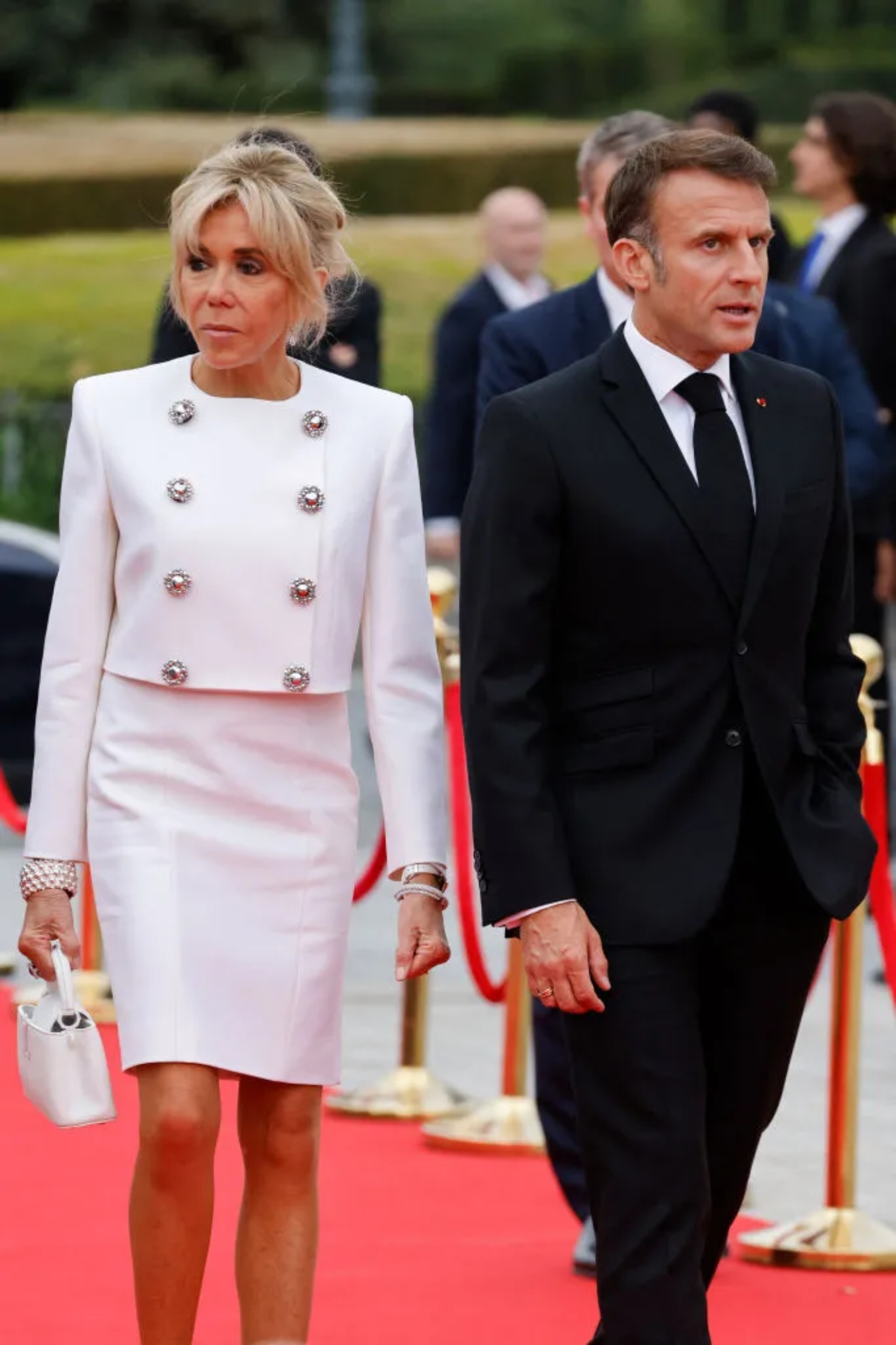 French President Emmanuel Macron and his wife Brigitte Macron arrive to attend a gala dinner hosted by the International Olympic Committee (IOC) and the French Presidency at the Louvre Museum in Paris, on the eve of the opening ceremony of the Paris 2024 Olympic Games, on July 25, 2024. (Photo by Ludovic MARIN / POOL / AFP) (Photo by LUDOVIC MARIN/POOL/AFP via Getty Images)