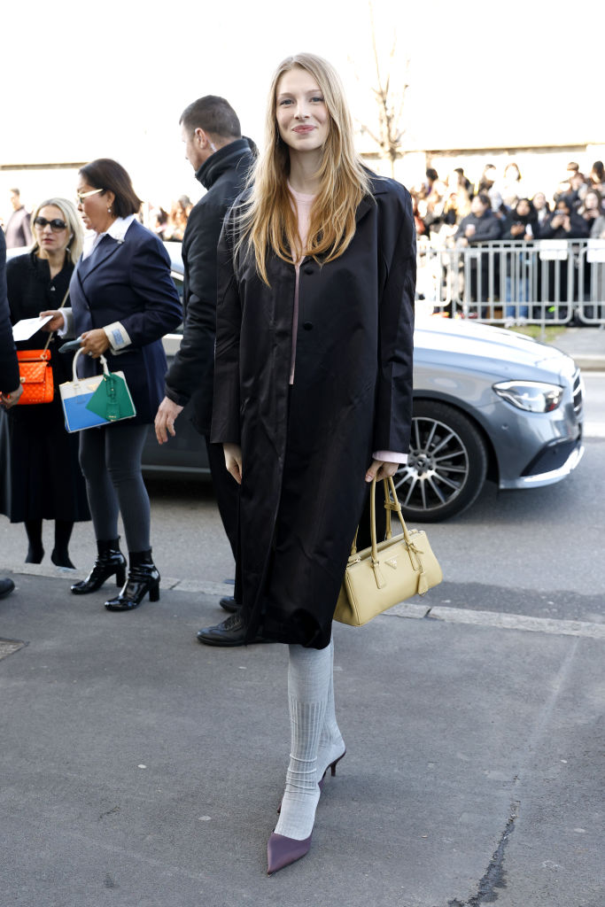 Hunter Schafer arrives at Prada's fall 2025 fashion show in Milan, pastels, front row